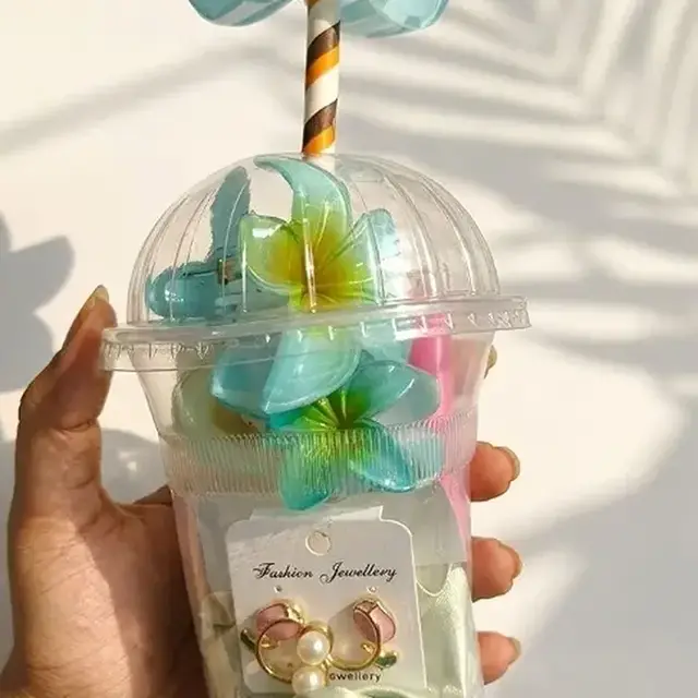 Clear gift cup with flower claws, earrings and lip gloss