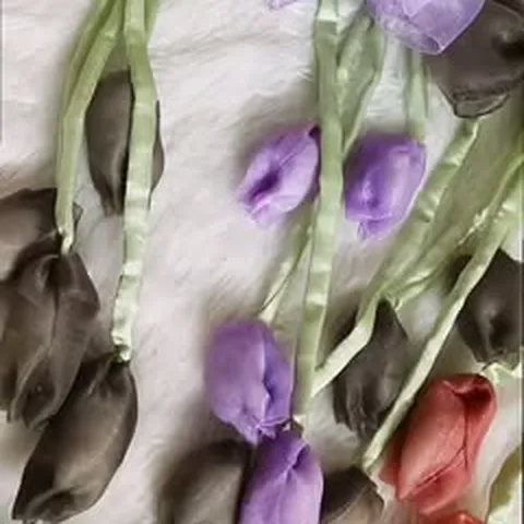 Organza tulip bows laid on white fur