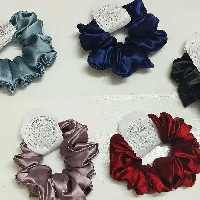Satin scrunchies in grey, navy, mauve and red